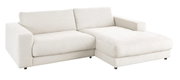 Beige longchair-set van stof, in perspectief gefotografeerd vanaf de linkervoorzijde.