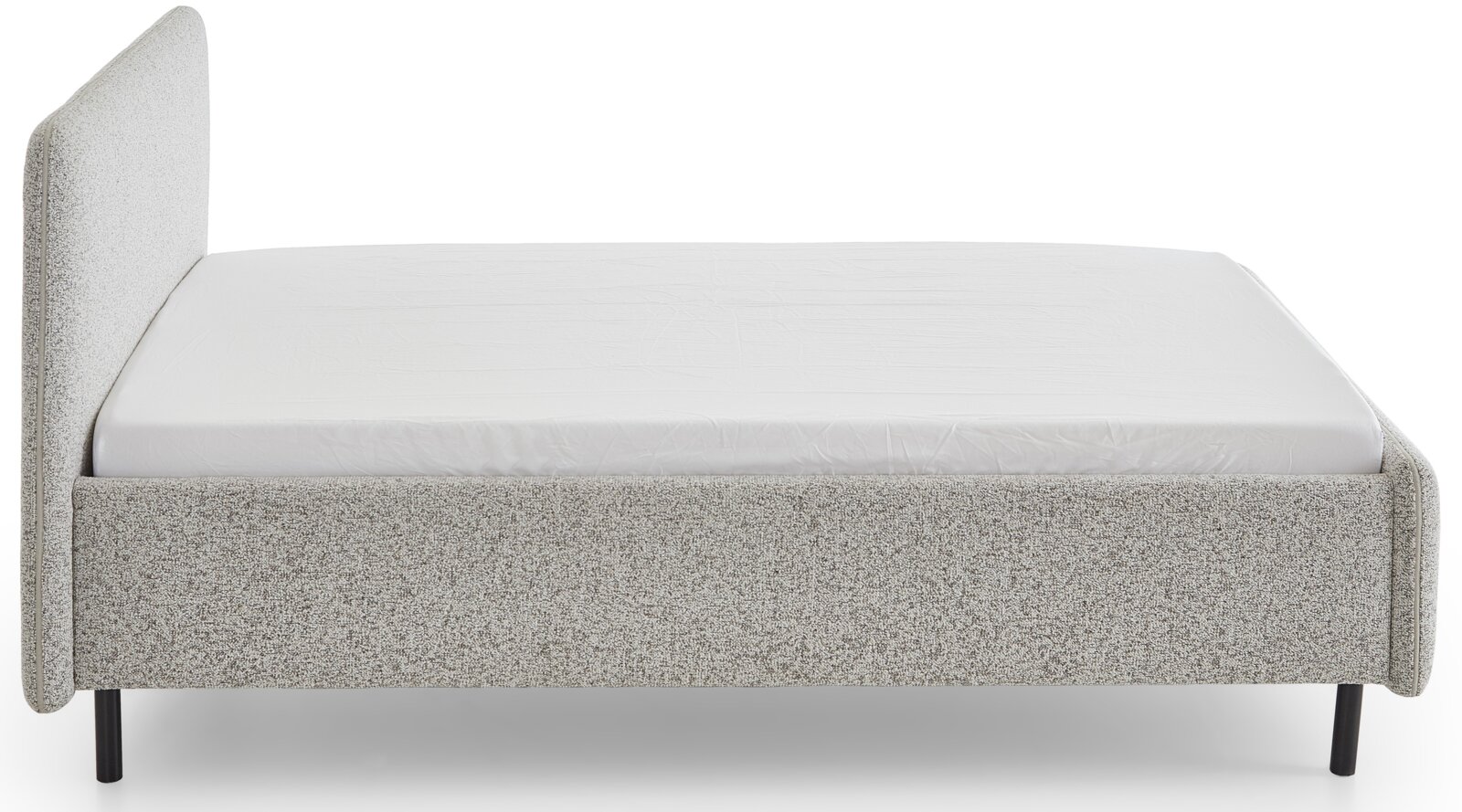 Seitliche Ansicht eines grauen Polsterbetts mit schlichtem Design und schwarzem Metallfuß.