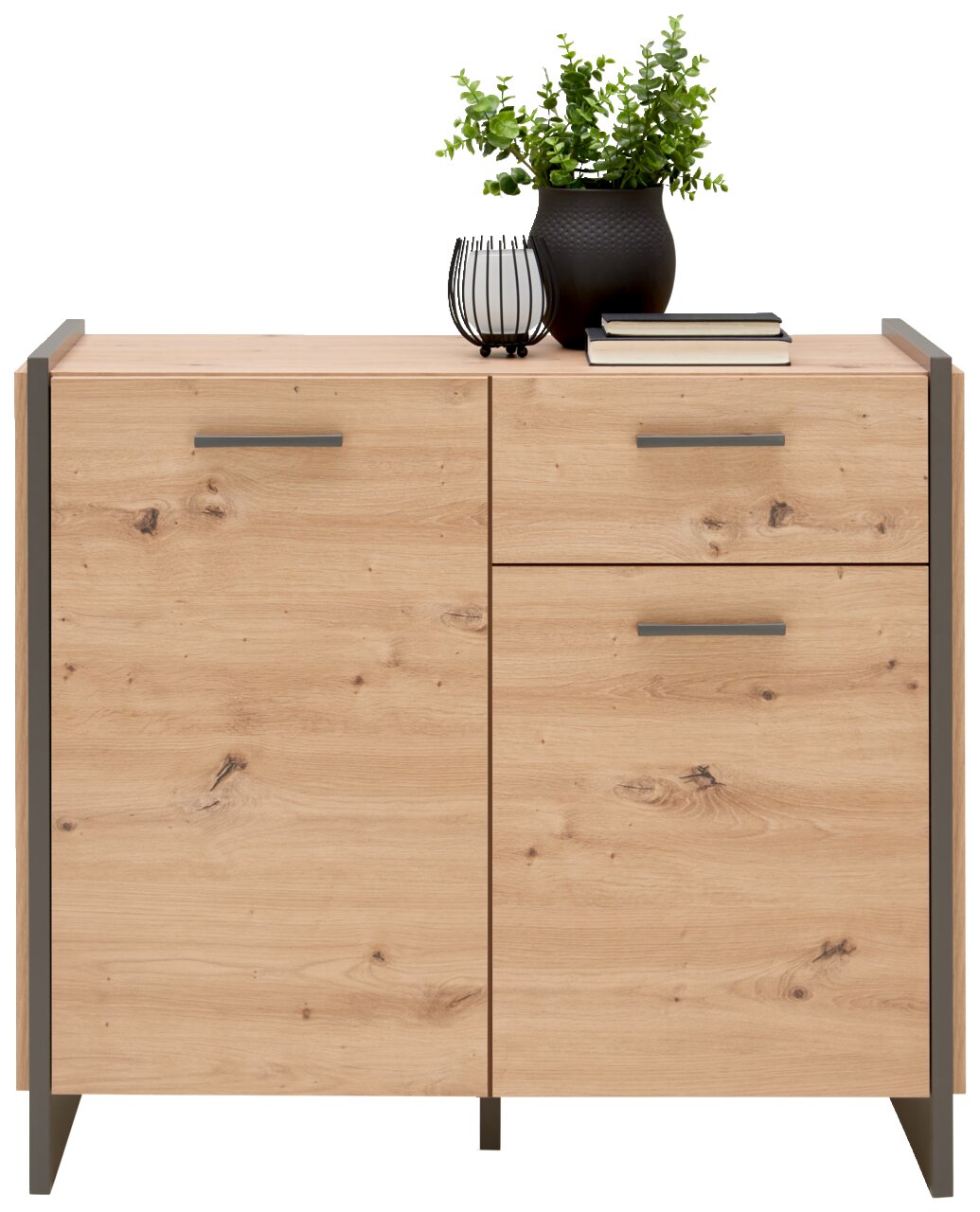 Holzkommode mit zwei Türen und einer Schublade, dekoriert mit einer Pflanze und Büchern, Frontalansicht