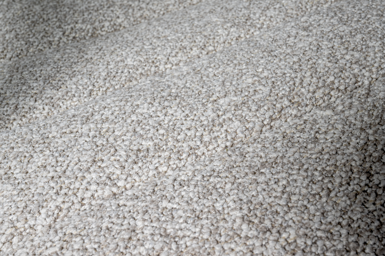 Nahaufnahme der strukturierten, grauen Stoffoberfläche eines Drehstuhlsitzes