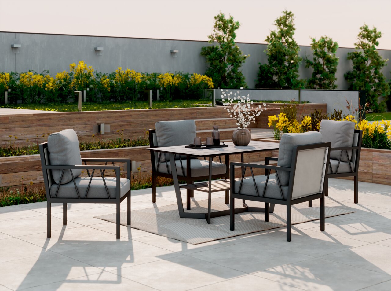 Amatio Pro Gartentisch ZAMORA Moderne Gartenmöbel-Sitzgruppe mit vier Sesseln und einem Tisch auf einer Terrasse, umgeben von blühenden Pflanzen. Perspektive von schräg vorne.