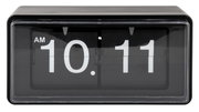 Schwarze Flip-Uhr mit weißer Anzeige, zeigt 10:11 AM, frontale Perspektive