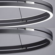 Moderne Pendelleuchte PURE-E-LOOP von Paul Neuhaus in seitlicher Perspektive, mit elegantem, ringförmigem Design und integrierter LED-Beleuchtung.