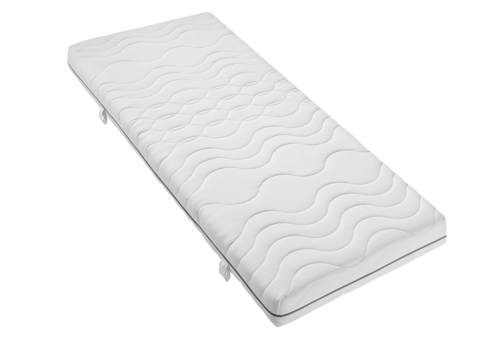 Wende-Kaltschaummatratze in schräger Perspektive, mit wellenförmigem Muster auf der Oberfläche.
