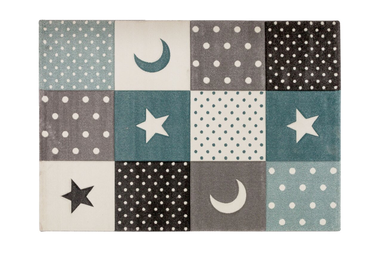 Teppich mit einem Muster aus Sternen, Monden und Punkten in Blau- und Grautönen, aus der Vogelperspektive fotografiert.
