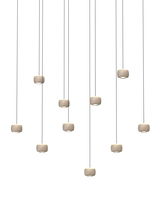 Mehrere LED-Pendelleuchten in moderner Anordnung, von unten betrachtet.