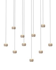 Mehrere LED-Pendelleuchten in moderner Anordnung, von unten betrachtet.