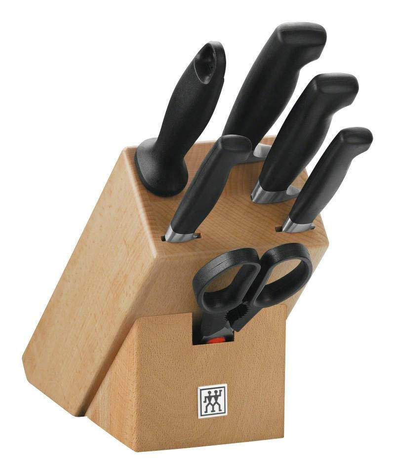 ZWILLING Messerblock 7tlg. Vier Sterne Messerblock mit sieben Teilen, darunter fünf Messer und eine Schere, aus Holz mit schwarzem Griff, seitliche Perspektive