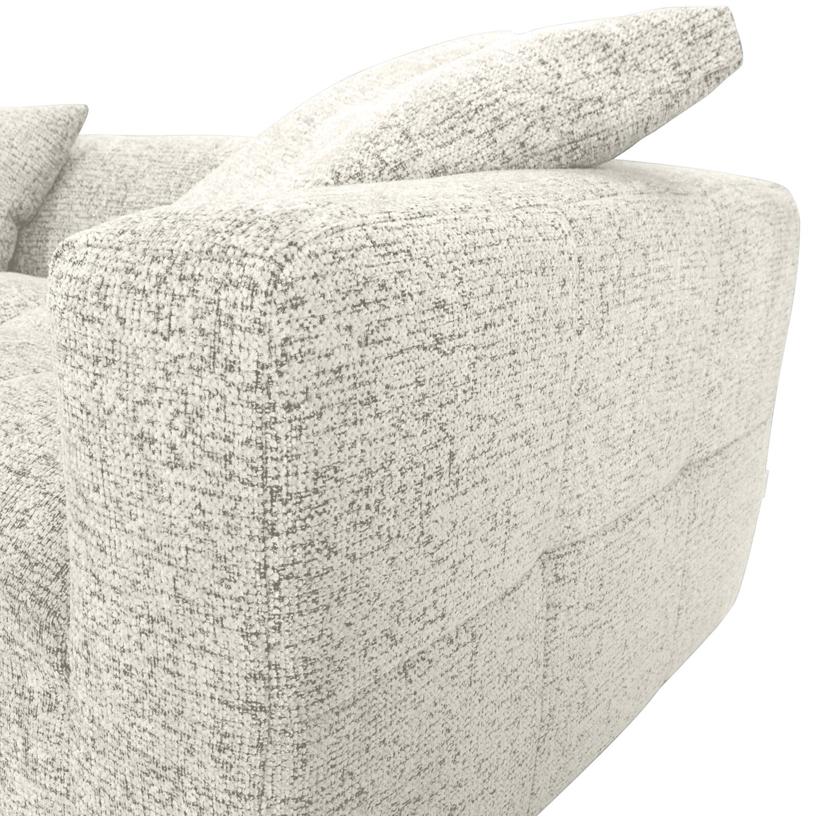 Nahaufnahme einer hellen, strukturierten Sofaecke mit Kissen, seitliche Perspektive.