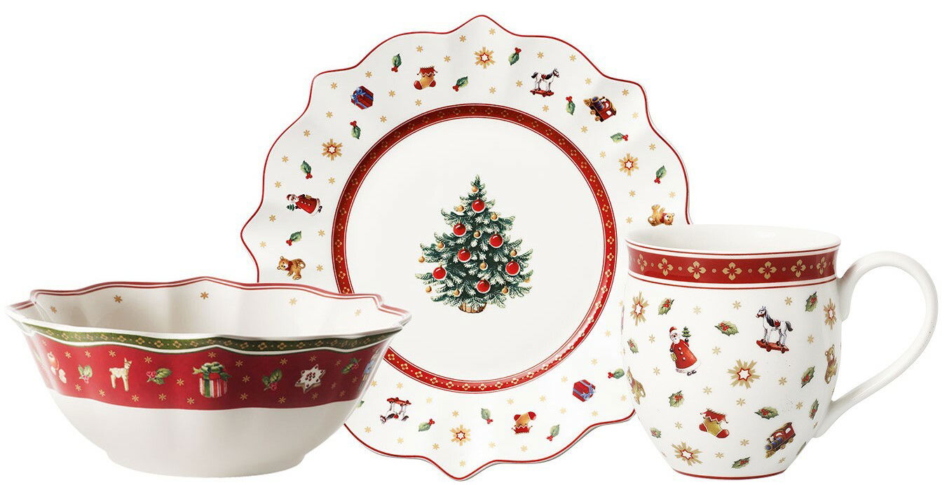 Frontalansicht eines weihnachtlichen Frühstückssets, bestehend aus einem Teller, einer Schale und einer Tasse, verziert mit festlichen Motiven wie einem Weihnachtsbaum, Geschenken und Schneeflocken.