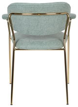 Rückansicht eines Armlehnstuhls mit goldfarbenem Metallrahmen und hellgrüner Polsterung.