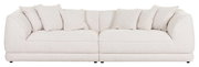 Großes, cremefarbenes Big-Sofa mit mehreren Kissen, frontal fotografiert.