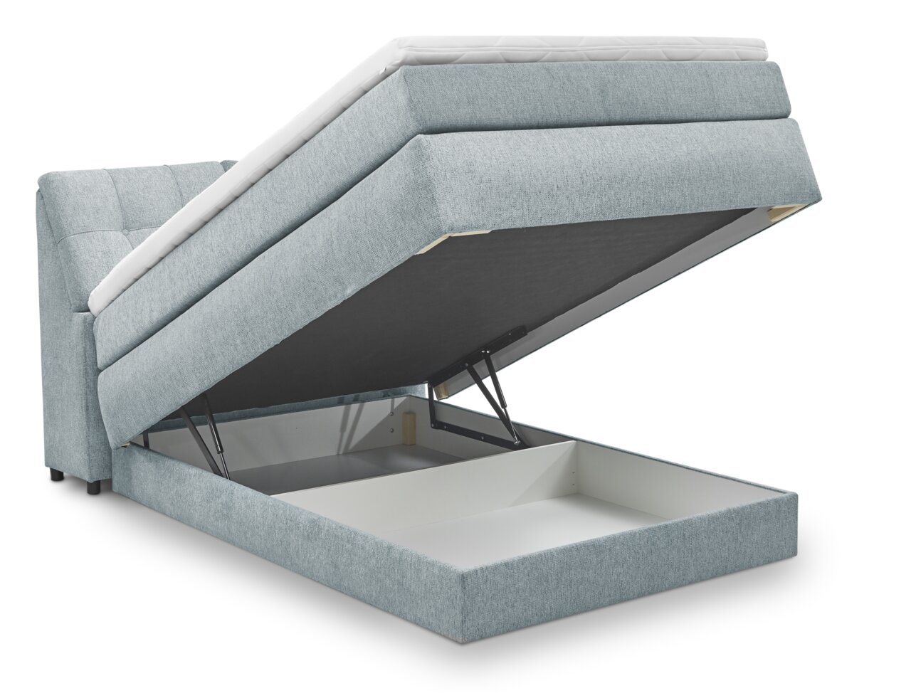 Boxspringbed Set One van Musterring Fairfield in zijaanzicht met geopende opbergruimte.