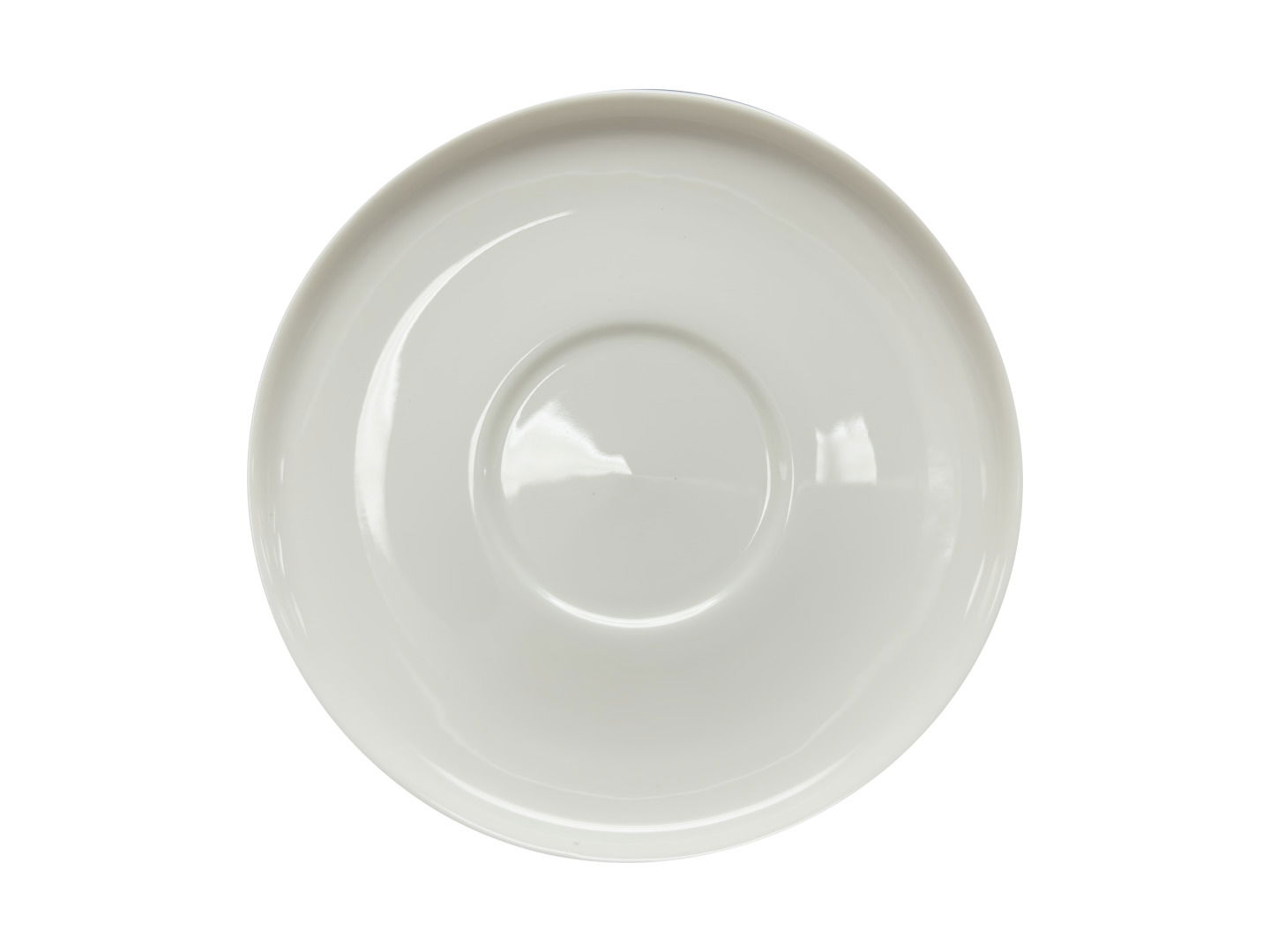 Weiße Untertasse aus der Vogelperspektive