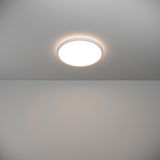 Runde LED-Deckenleuchte ROVITO, von unten betrachtet, mit sanftem Lichtschein an der Decke.
