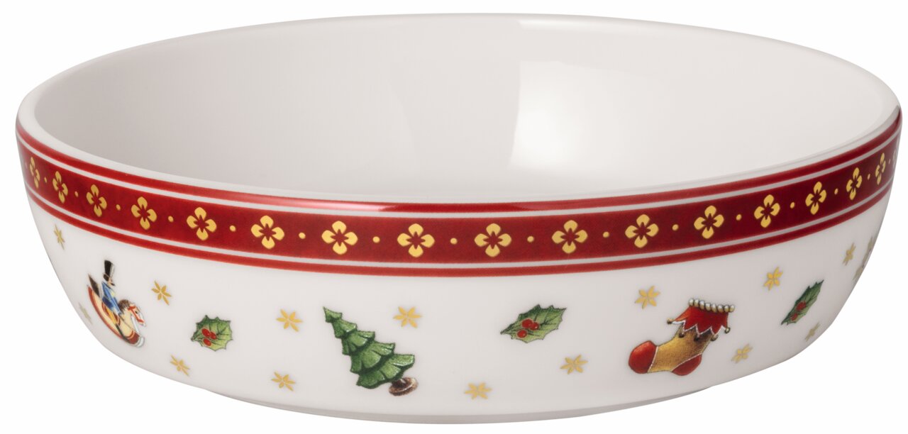 Weiße Schale mit weihnachtlichen Motiven wie Weihnachtsbaum, Stechpalmenblättern und rotem Rand, seitliche Perspektive