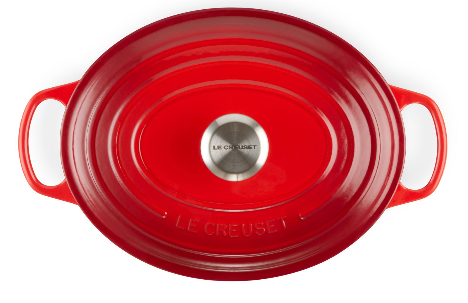 Roter ovaler Bräter von oben mit zwei Griffen und einem silbernen Knauf, Markenname Le Creuset sichtbar.