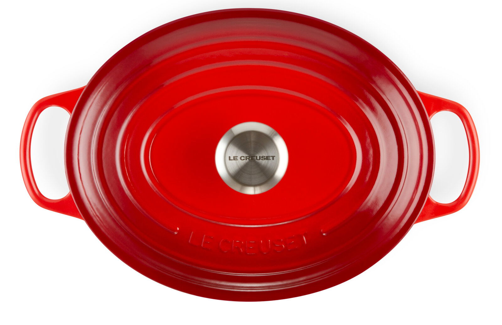 Roter ovaler Bräter von oben mit zwei Griffen und einem silbernen Knauf, Markenname Le Creuset sichtbar.
