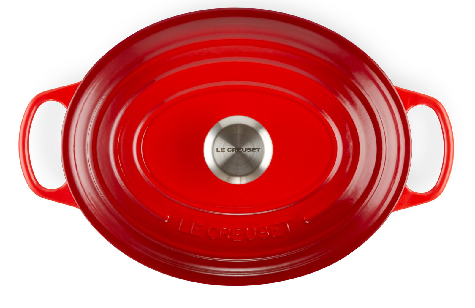 Roter ovaler Bräter von oben mit zwei Griffen und einem silbernen Knauf, Markenname Le Creuset sichtbar.