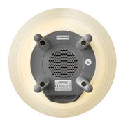 Unteransicht einer Akku-Leuchte mit Lautsprecher, graue Basis mit vier Standfüßen und zentralem Lautsprechergitter, umgeben von einem leuchtenden Ring.