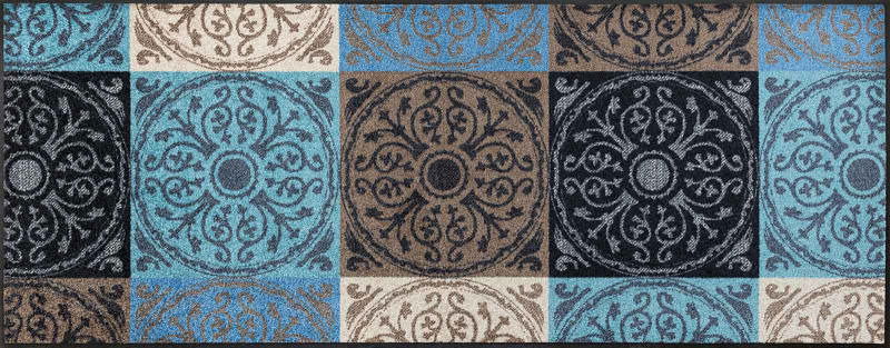 Fußmatte Da Capo mit dekorativem Muster in Blau-, Braun- und Beigetönen, von oben betrachtet.