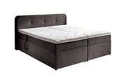 Boxbett mit Motor in seitlicher Perspektive, dunkelgrau mit weißer Matratze und Kopfteil mit Knopfdetails