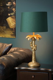 Tischlampe COCONUT mit goldener Palmenbasis und grüner Schirm, seitliche Perspektive