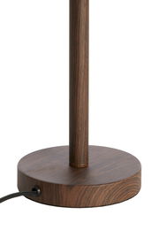 Nahaufnahme eines runden Lampenfußes aus Holz mit Kabelanschluss, seitliche Perspektive.