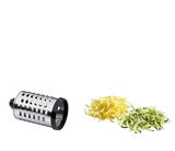 Trommelreibe Rapid aus seitlicher Perspektive mit geriebenem Käse und Zucchini.