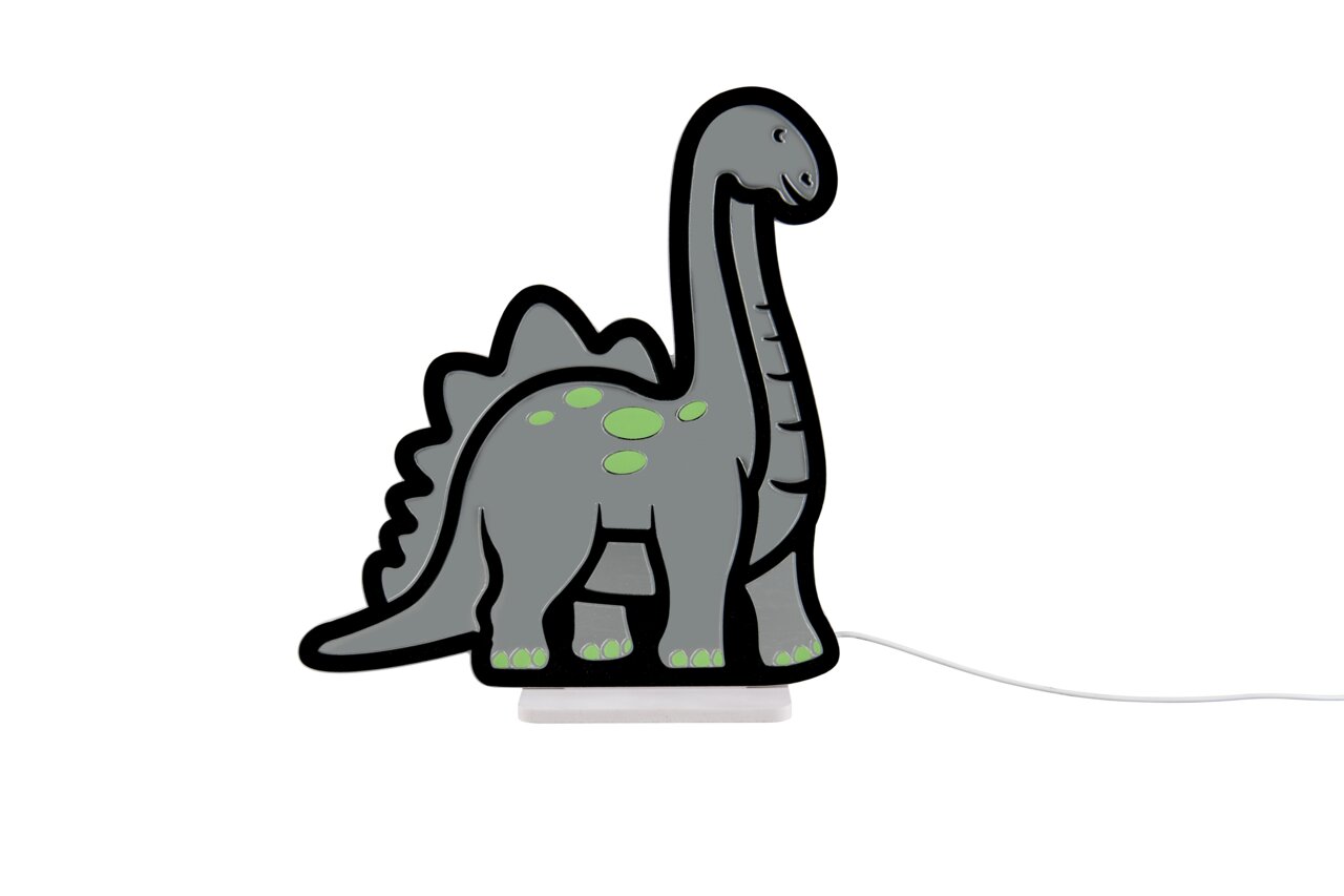Graue Dinosaurier-Kinderlampe mit grünen Punkten und schwarzer Kontur auf weißem Sockel, Kabel rechts sichtbar, Produktansicht von vorne