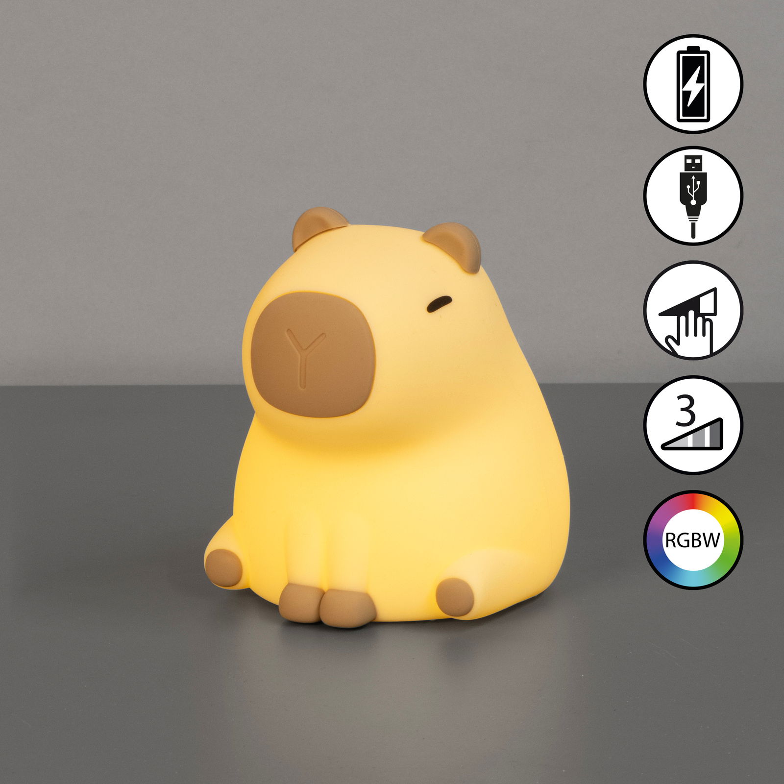 Gelbes Akku-Nachtlicht in Form eines sitzenden Schweins, frontal fotografiert, mit USB-Ladefunktion und RGBW-Farbwechsel.
