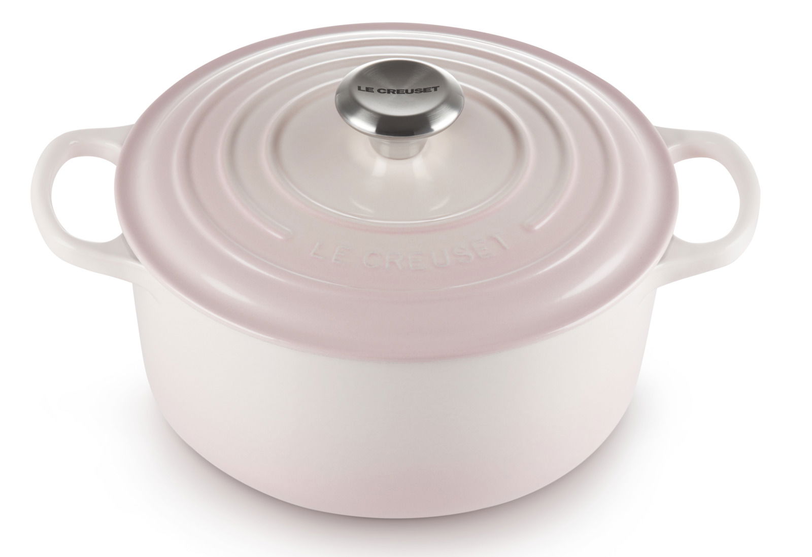 Runder Bräter von Le Creuset in zartem Rosa, 24 cm Durchmesser, aus der Vogelperspektive fotografiert.