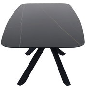 Moderner schwarzer Esstisch mit rechteckiger Tischplatte und schrägen Beinen, Ansicht von oben.