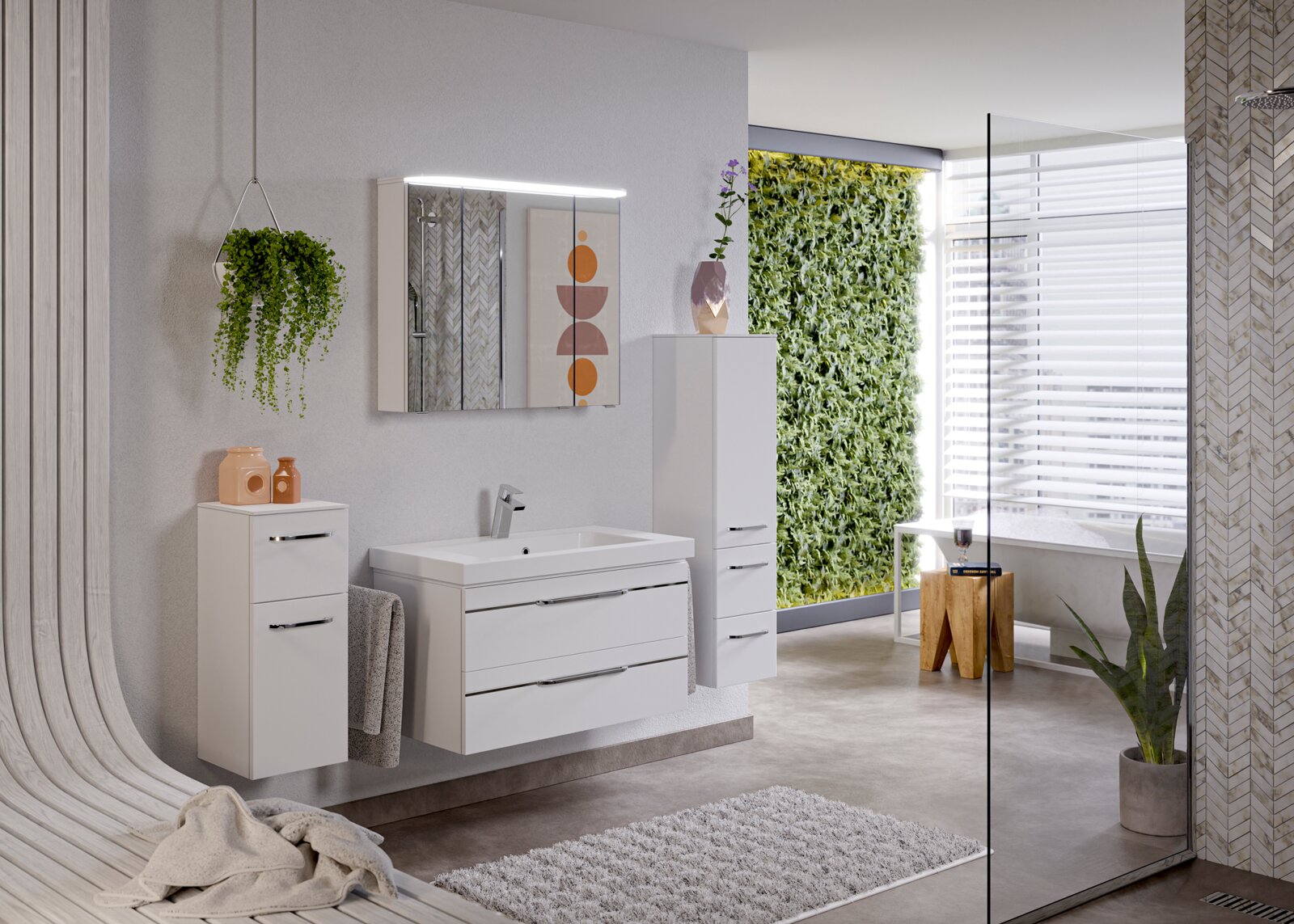 Moderne badkamermeubels in een stijlvolle badkamer met een hangplant, een verlichte spiegel en een groene muur op de achtergrond, gezien vanuit het linkerperspectief.