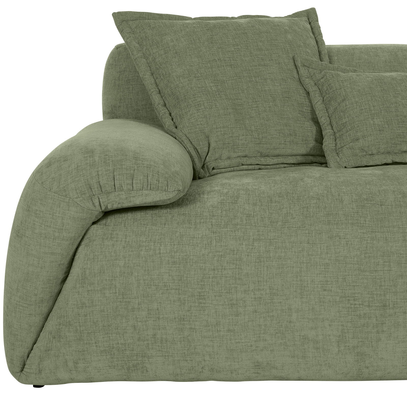 Grüne Rundecke mit weichen Kissen, seitliche Perspektive