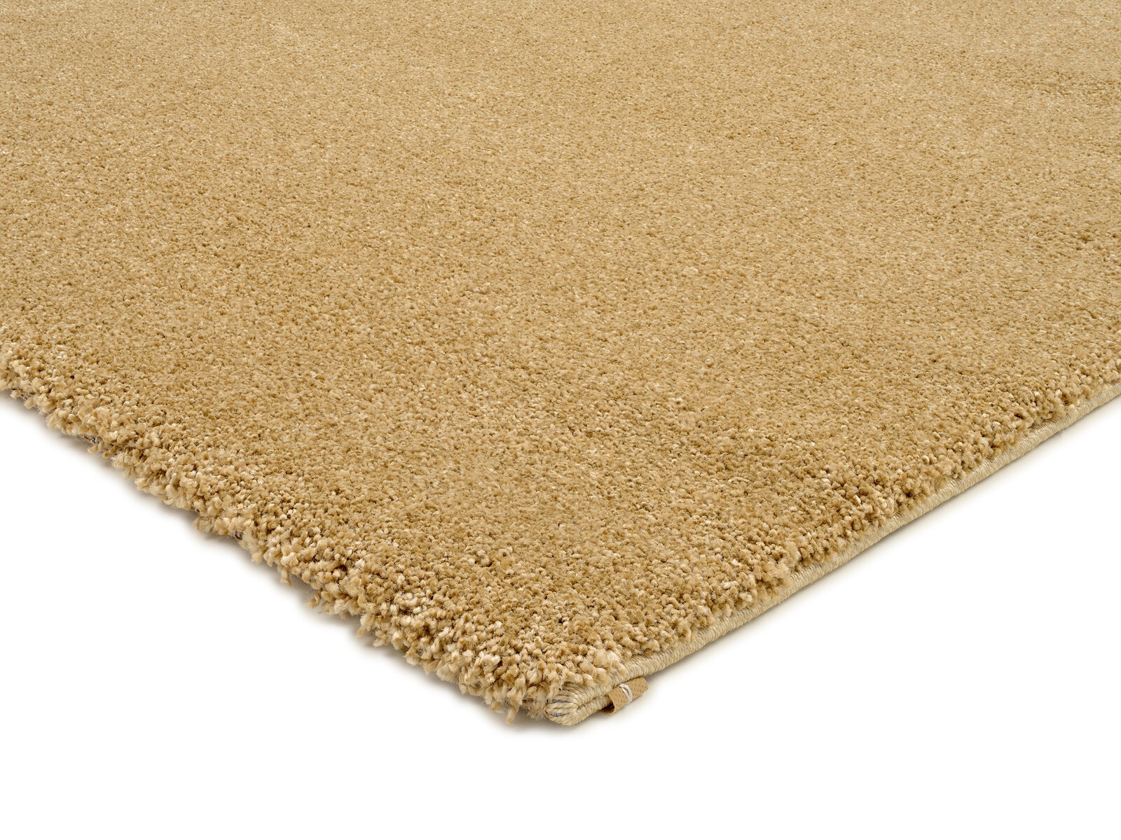 Beige Uni-Teppich in Nahaufnahme, perspektivisch von der Ecke aus gesehen