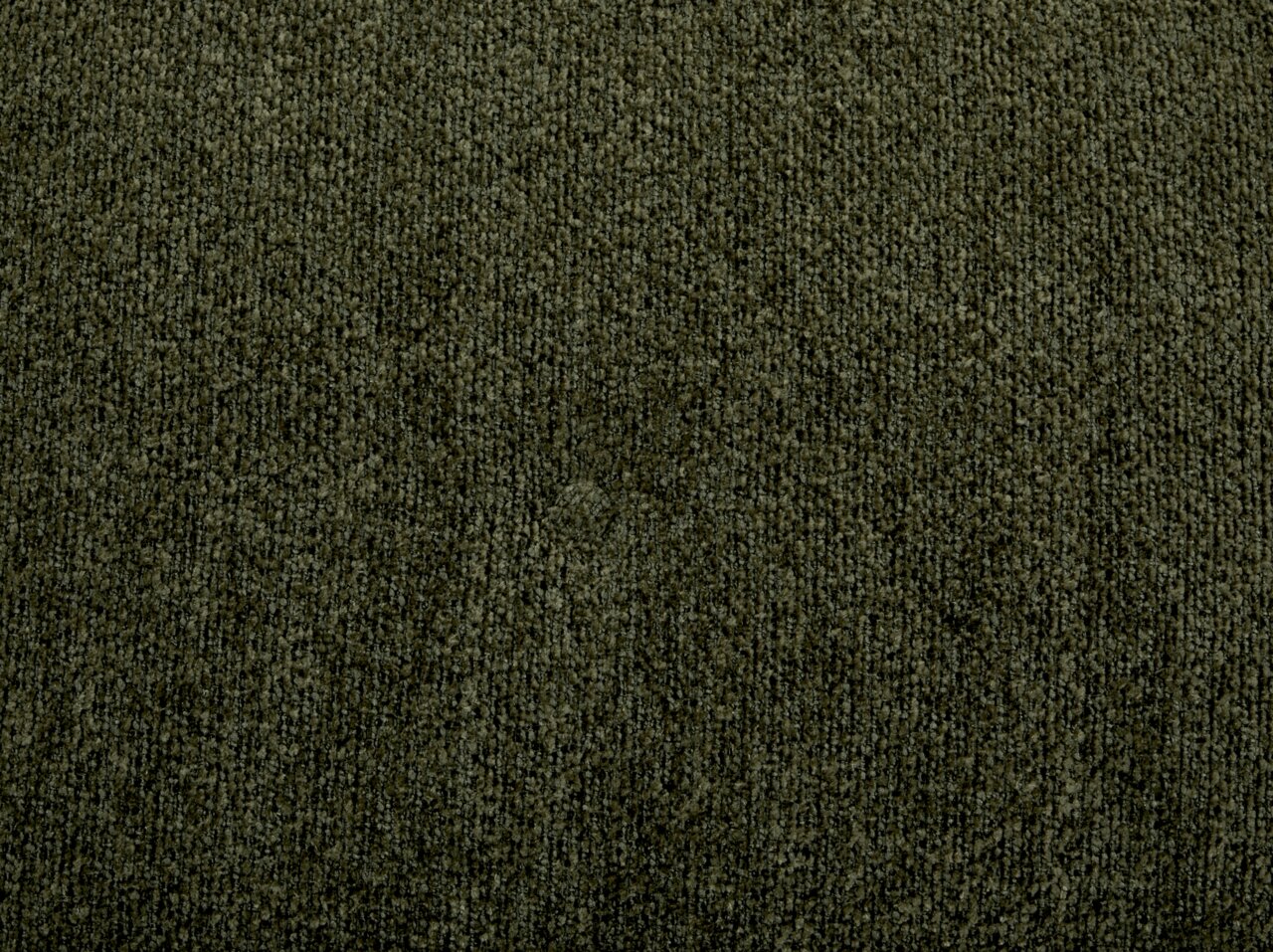 Nahaufnahme eines dunkelgrünen Stoffes mit texturierter Oberfläche, Draufsicht
