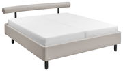 Modernes Polsterbett in Beige mit abgerundeter Rückenlehne, seitliche Perspektive