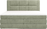 Gestoffeerd boxspringbed met groen/grijze geweven bekleding, wit matras en gewatteerd hoofdbord, frontale aanzicht (voorzijde)
