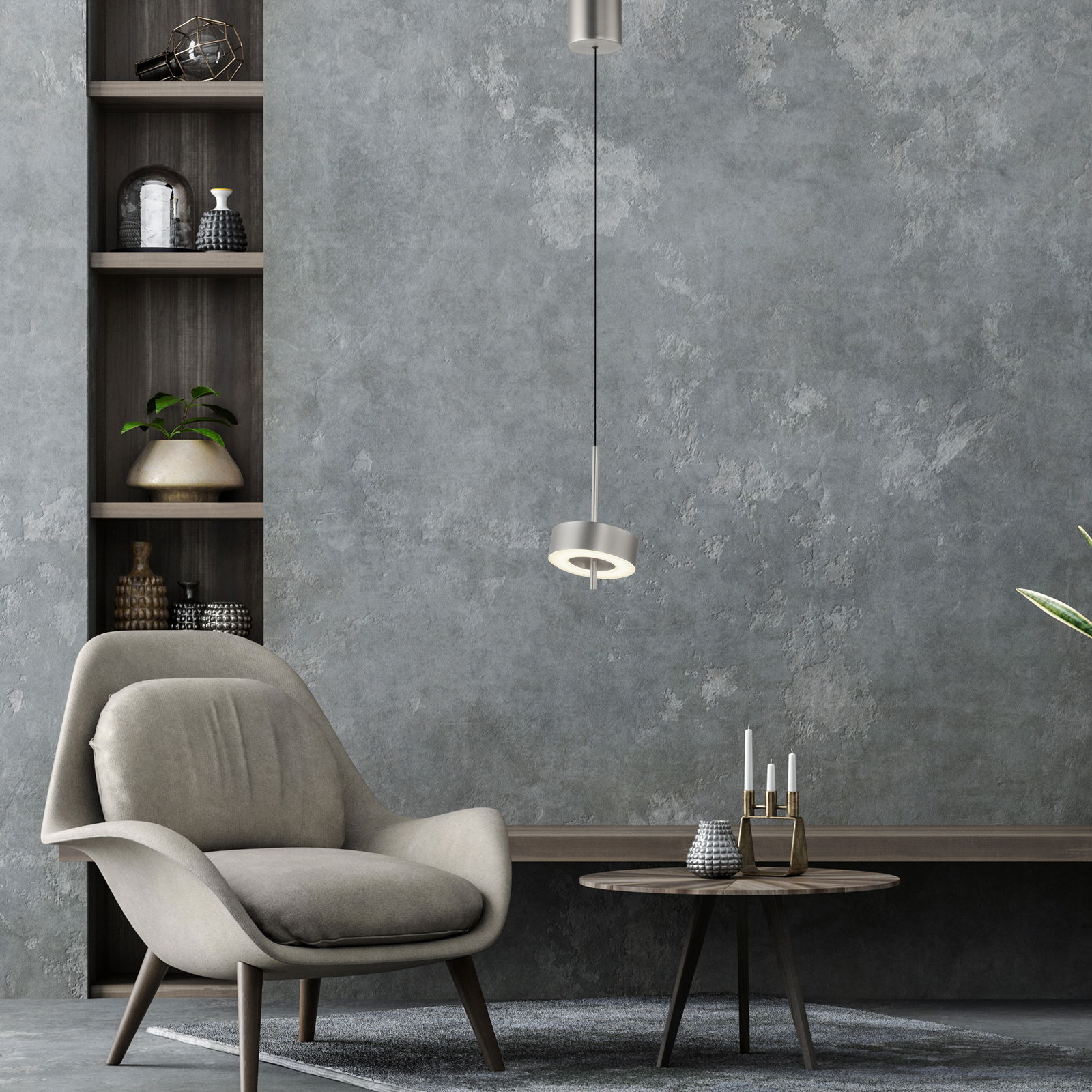 Moderne Pendelleuchte Q-ROTATE in einem stilvollen Wohnzimmer, seitliche Perspektive.