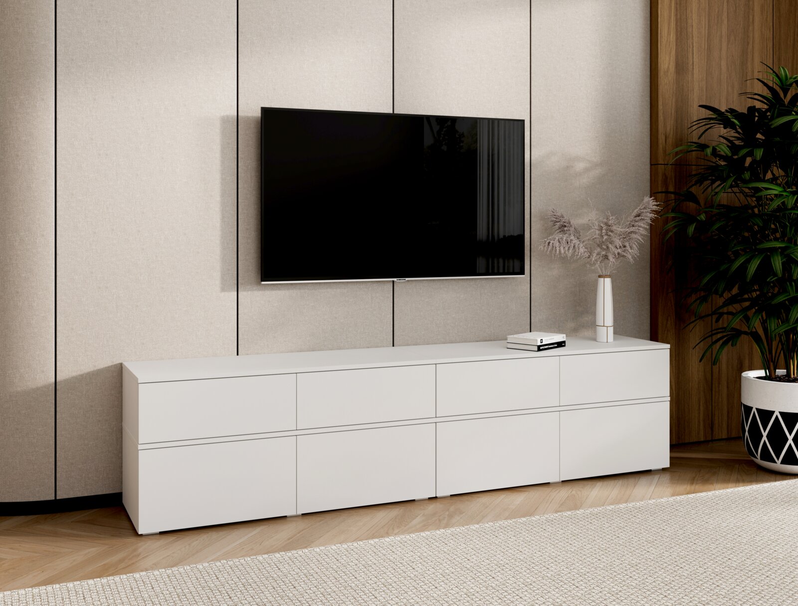 XORA TV-Lowboard SCALE Modernes weißes Lowboard/TV-Board mit glatter Front und mehreren Fächern unter einem wandmontierten Flachbildfernseher im Wohnzimmer, Ansicht frontal mit leichter Perspektive von links.