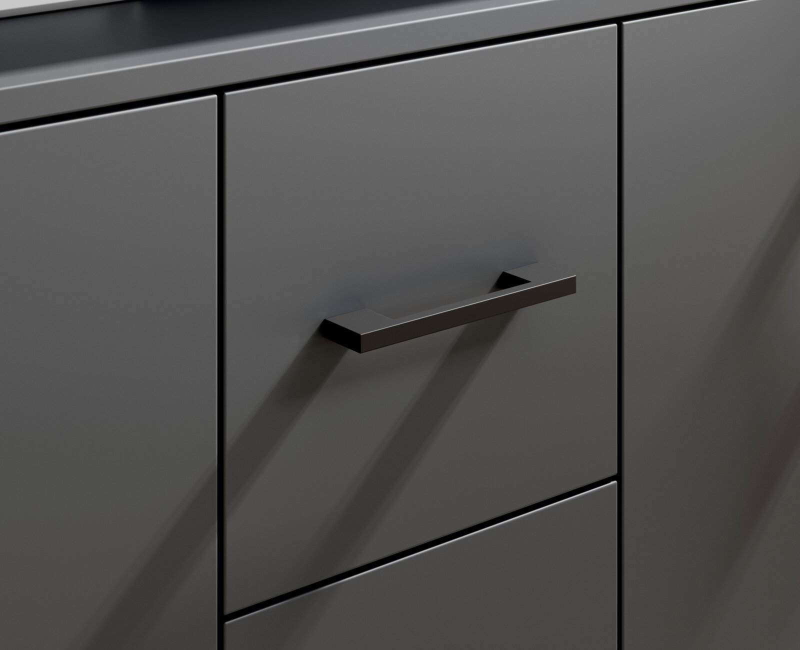 Close-up van een modern, grijs dressoir met minimalistische zwarte handgrepen, gezien vanaf de zijkant.