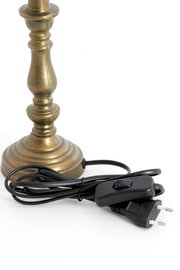 Nahaufnahme eines bronzefarbenen Lampenfußes mit Kabel und Schalter, seitliche Perspektive.