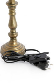 Nahaufnahme eines bronzefarbenen Lampenfußes mit Kabel und Schalter, seitliche Perspektive.