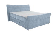 Boxspringbett in hellblauem Stoffbezug, seitliche Perspektive