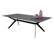 Nahaufnahme einer offenen Schublade einer schwarzen Nachtkonsole, Perspektive von oben.