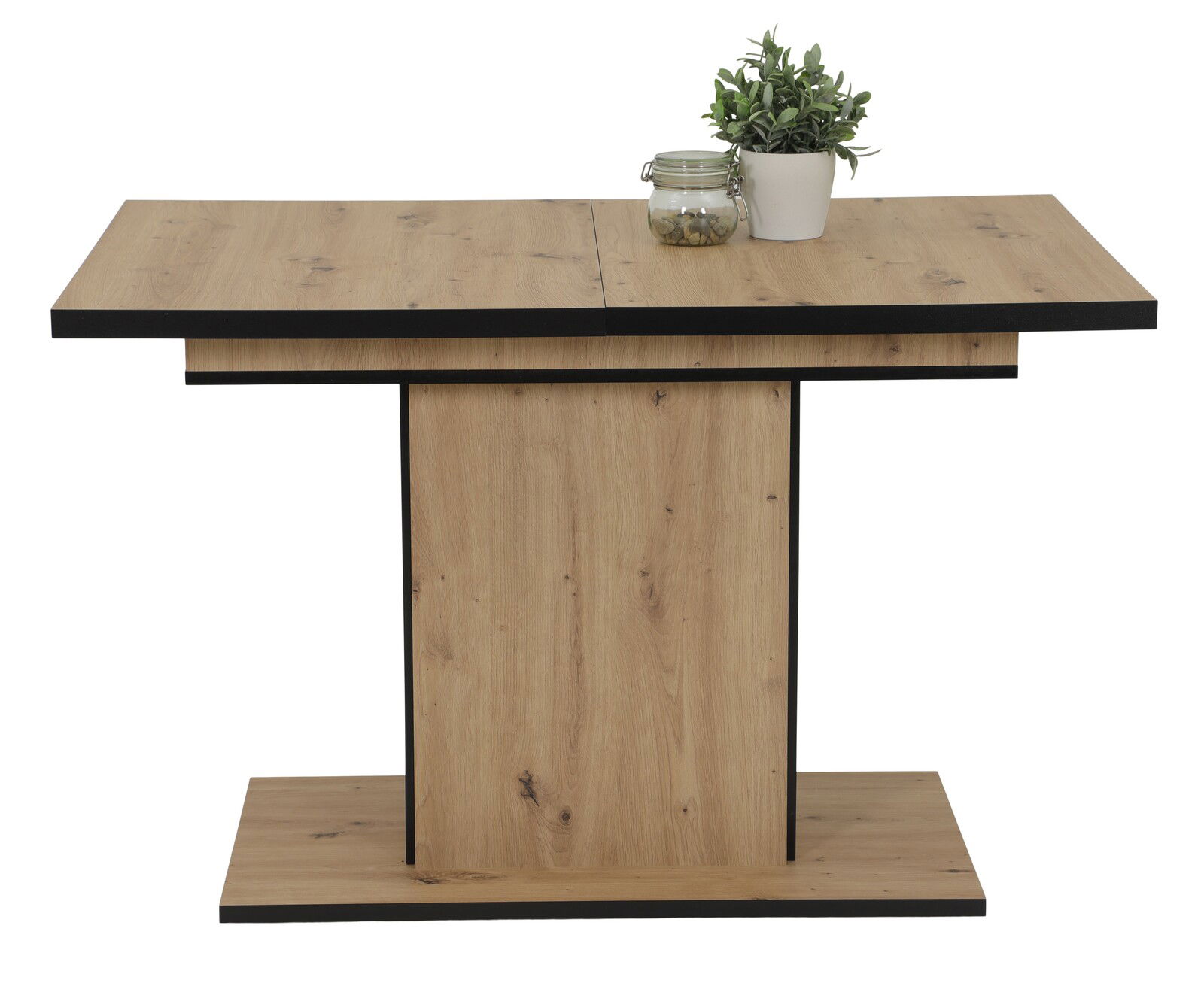 Moderner Esstisch aus Holz mit schwarzem Rand, frontal fotografiert, dekoriert mit einer Pflanze und einem Glasgefäß.