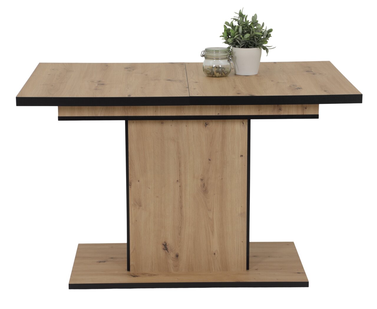 Moderner Esstisch aus Holz mit schwarzem Rand, frontal fotografiert, dekoriert mit einer Pflanze und einem Glasgefäß.