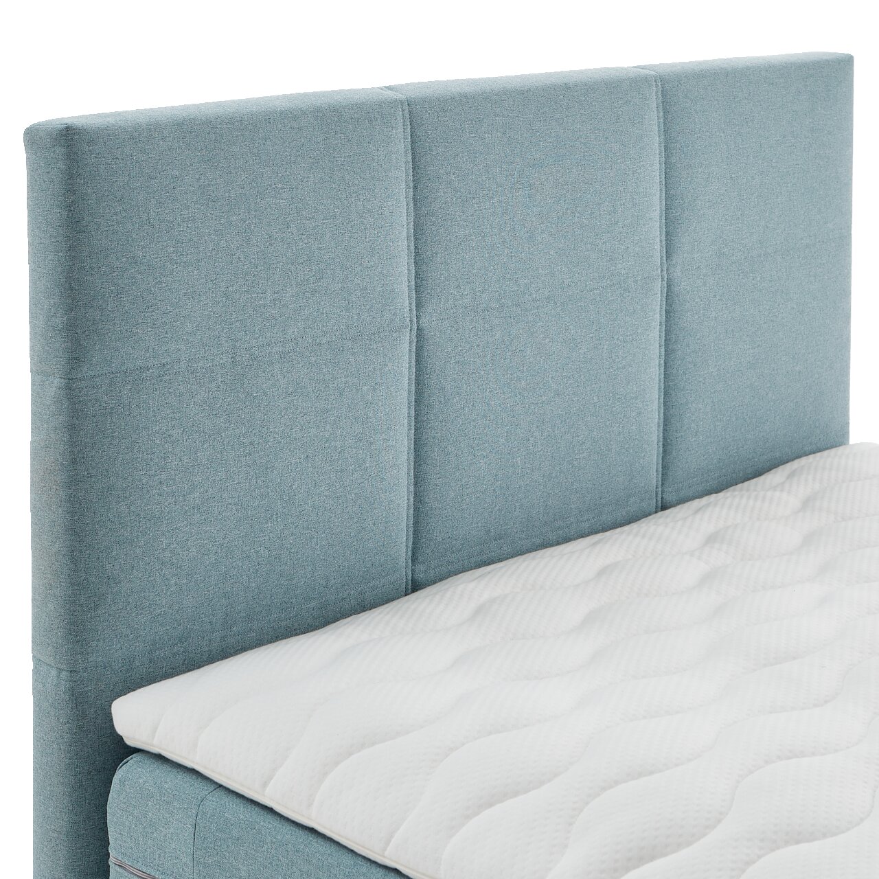 Boxspringbett mit hellblauem Kopfteil und weißer Matratze, seitliche Perspektive