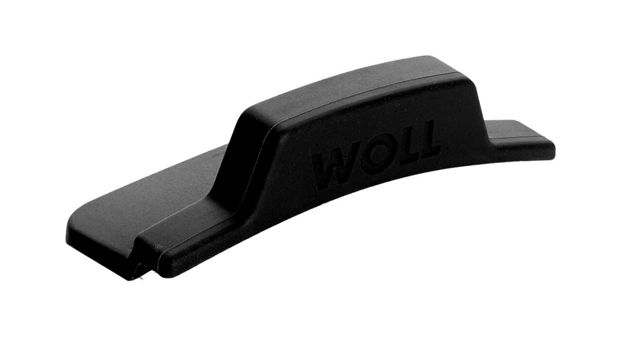 Schwarzer Silikongriff mit der Aufschrift 'WOLL', seitliche Perspektive
